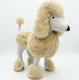Large poodle stuffed animal handmade in Peru from natural beige alpaca fur, 27 inches tall, standing in profile