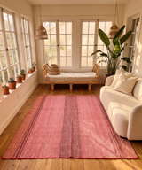 Archival Textile No. 107: A large vintage Peruvian Frazada rug featuring a rose and berry diamond eye weave. This one-of-a-kind hand-loomed wool rug serves as a statement area rug or architectural wall art for modern minimalist interiors."