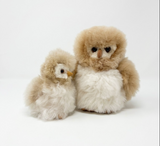 Two alpaca fur owl stuffed animals side by side, showing the size difference between the 6" Mini and 12" sizes