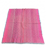 A vintage Peruvian Frazada rug featuring a fuchsia and orange chromatic sequence. This hand-loomed wool textile showcases a traditional central union seam and is suitable as a Bohemian floor covering or wall hanging."