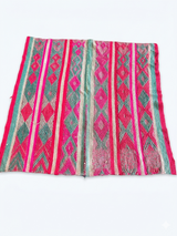 Alt Text: Archival Textile No. 111: A vibrant vintage Peruvian Frazada rug featuring a high-contrast neon magenta and teal diamond pattern. This one-of-a-kind hand-loomed wool rug is shown on a white background, highlighting its traditional central union seam and maximalist geometric design.