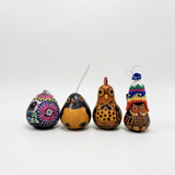 Set of four hand-carved Peruvian gourd Christmas ornaments — a hand-painted floral hummingbird gourd, a black and orange painted gourd bird, a hand-carved owl gourd, and an owl gourd with a hand-knitted Andean chullo hat — handmade in Cochas, Huancayo, Peru.