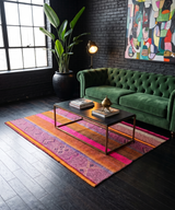 Archival Textile No. 106: A large vintage Peruvian Frazada rug with an electric fuchsia center and indigo geometric symbols. This one-of-a-kind hand-loomed wool rug serves as a statement area rug or architectural wall art.