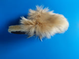 Undyed tan alpaca house shoes with non-slip suede soles.