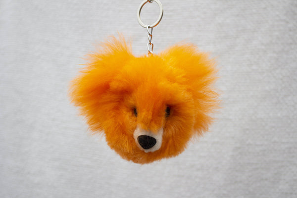 Orange bear alpaca fur keychain with glass eyes and lobster clasp, handmade in Peru