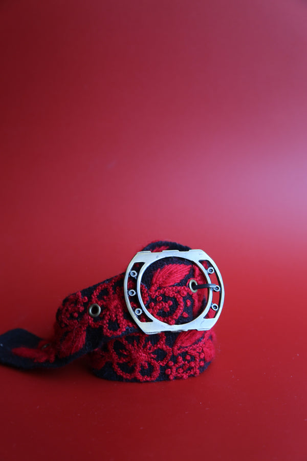 Black wool belt hand-embroidered with red flowers, handmade in Ayacucho, Peru